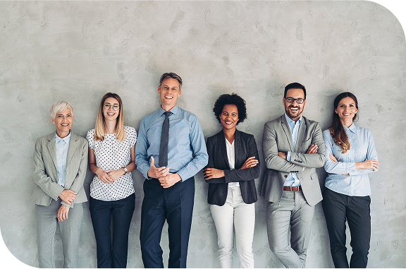 People in business casual standing against a wall